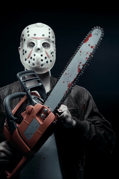 maniac-mask-holding-bloody-chainsaw-600nw-781087678